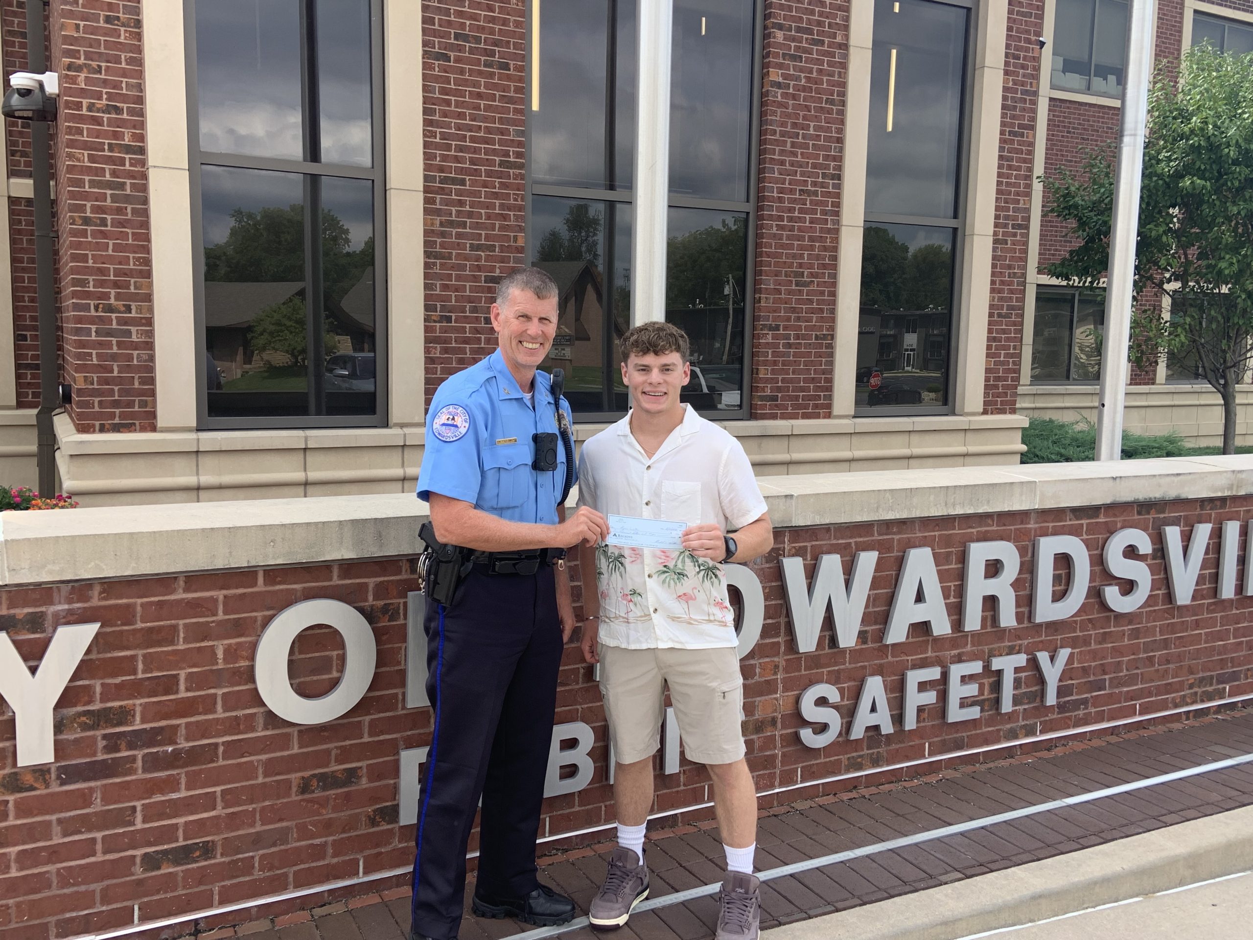 Chief Michael Fillback presenting Mason Walker with her scholarship check.